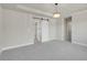 Main bedroom boasting a barn door and ensuite bathroom access at 17186 E Cedar Gulch Dr, Parker, CO 80134
