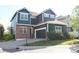 Charming two-story home with a well-maintained lawn and an attached two-car garage at 1710 S Poplar St, Denver, CO 80224
