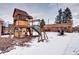 Large backyard with playset, shed, and snow at 2391 Lansing St, Aurora, CO 80010