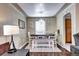 Bright dining area with chandelier and wooden table at 2391 Lansing St, Aurora, CO 80010