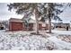 Brick ranch house with snowy front yard at 2391 Lansing St, Aurora, CO 80010