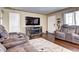 Living room with electric fireplace and hardwood floors at 2391 Lansing St, Aurora, CO 80010