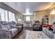 Open living and dining area with hardwood floors and lots of light at 2391 Lansing St, Aurora, CO 80010