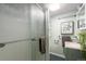 Cozy bathroom with a glass-door shower, simple vanity, and neutral tones for a refreshing space at 4295 Picutis Rd, Indian Hills, CO 80454