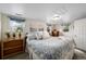 Bright bedroom with a comfortable bed, natural light, and simple decor for a relaxing atmosphere at 4295 Picutis Rd, Indian Hills, CO 80454