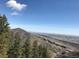 Scenic view of a mountain range and forest landscape under a clear sky at 4295 Picutis Rd, Indian Hills, CO 80454
