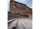Iconic view of Red Rocks Amphitheatre with its sandstone formations and rows of seats at 4295 Picutis Rd, Indian Hills, CO 80454