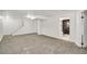 Spacious basement features modern lighting, neutral carpet, and easy access to a convenient full bathroom at 8095 Johnson Ct, Arvada, CO 80005