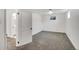 Neutral bedroom includes new carpeting, a window for natural light, and ensuite bathroom access at 8095 Johnson Ct, Arvada, CO 80005