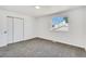 Bright and airy bedroom with new carpet, a closet, and a large window offering abundant natural light at 8095 Johnson Ct, Arvada, CO 80005