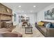 Spacious living room featuring a wood-burning fireplace and seamlessly connects to the modern kitchen at 8095 Johnson Ct, Arvada, CO 80005
