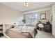 Serene bedroom with a large window, neutral tones, and ample natural light at 1630 Egret Way, Superior, CO 80027