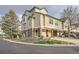 Charming townhouse with attached garages, enhanced by mature trees and a well-kept front yard at 1630 Egret Way, Superior, CO 80027
