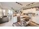 Bright, open kitchen featuring modern appliances, granite countertops, and a stainless steel kitchen island at 1630 Egret Way, Superior, CO 80027