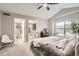 Spacious main bedroom featuring plush carpet, ensuite bathroom, and lots of light from the large window at 1630 Egret Way, Superior, CO 80027
