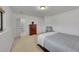Bedroom featuring carpeted floors, a large window, and a dresser at 7077 S Bryant St, Littleton, CO 80120