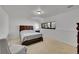 Bedroom with carpet floors and a large window providing natural light at 7077 S Bryant St, Littleton, CO 80120