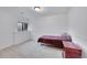 Cozy bedroom with carpeted floors and a small window at 7077 S Bryant St, Littleton, CO 80120
