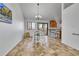 Bright dining area with tile floor, view to the kitchen, and a chandelier at 7077 S Bryant St, Littleton, CO 80120