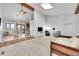 Spacious living room with high ceilings, tile floor and an adjacent dining area at 7077 S Bryant St, Littleton, CO 80120