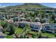 Nice aerial view of the homes and yards with green space and a mountain backdrop at 16627 W 1St Ave, Golden, CO 80401