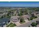 Expansive aerial view of the homes and neighborhood with mountain views beyond the trees at 16627 W 1St Ave, Golden, CO 80401