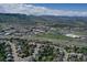 Aerial view of a neighborhood with scenic mountain views, commercial and highway access at 16627 W 1St Ave, Golden, CO 80401