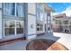Large back deck with decorative outdoor rug extends from the home at 16627 W 1St Ave, Golden, CO 80401