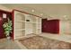 Finished basement with custom built-in shelving and unique wall textures at 16627 W 1St Ave, Golden, CO 80401