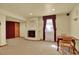 Basement featuring a fireplace, dining table, and curtained windows at 16627 W 1St Ave, Golden, CO 80401
