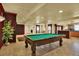 Expansive basement area with a pool table, bar, and flexible living space at 16627 W 1St Ave, Golden, CO 80401