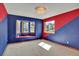 Bright bedroom with large windows, window seating, and unique wall design at 16627 W 1St Ave, Golden, CO 80401