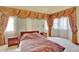 Comfortable bedroom with draped windows and side tables at 16627 W 1St Ave, Golden, CO 80401