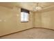 Bright bedroom with neutral colors, carpet, and window at 16627 W 1St Ave, Golden, CO 80401