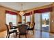 Elegant dining room with hardwood floors, a chandelier, and sliding doors to the outdoor area at 16627 W 1St Ave, Golden, CO 80401