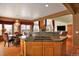 Kitchen with hardwood floors, breakfast table, stone countertop, and grand chandelier at 16627 W 1St Ave, Golden, CO 80401