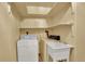 Laundry room featuring a sink, washer, and dryer hookups at 16627 W 1St Ave, Golden, CO 80401
