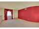 Bright living room with plush carpeting and decorative window treatments at 16627 W 1St Ave, Golden, CO 80401