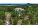 Secluded home nestled among lush trees with expansive grounds at 1127 Buttermilk Rd, Larkspur, CO 80118