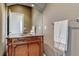Bathroom with an ornate wood cabinet, granite countertop, mirror, and neutral color scheme at 1127 Buttermilk Rd, Larkspur, CO 80118