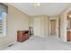 Well-lit bedroom with neutral walls, and multiple doorways at 1127 Buttermilk Rd, Larkspur, CO 80118
