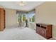 Bright bedroom with a large window offering natural light and a view at 1127 Buttermilk Rd, Larkspur, CO 80118