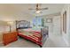 Charming bedroom with an ornate bed frame, scenic view windows, and a cozy atmosphere at 1127 Buttermilk Rd, Larkspur, CO 80118