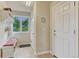 Cozy entryway featuring a bench with storage, a window for natural light, and convenient access to other areas at 1127 Buttermilk Rd, Larkspur, CO 80118
