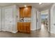 Coffee station in kitchen area with wood cabinets and white trim at 1127 Buttermilk Rd, Larkspur, CO 80118