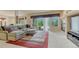 Relaxing living room featuring plush seating, a fireplace, and sliding glass doors opening to outdoor space at 1127 Buttermilk Rd, Larkspur, CO 80118