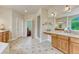 Spacious main bathroom with dual sink vanity and walk-in shower at 1127 Buttermilk Rd, Larkspur, CO 80118