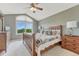 Serene main bedroom with a large window offering beautiful mountain views and a comfortable bed at 1127 Buttermilk Rd, Larkspur, CO 80118