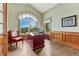 Office with hardwood floors, wainscotting, a large window, and a classic desk at 1127 Buttermilk Rd, Larkspur, CO 80118