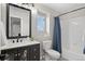 Bathroom featuring a vanity with dark fixtures and a shower and tub combination at 24738 E Layton Pl, Aurora, CO 80016